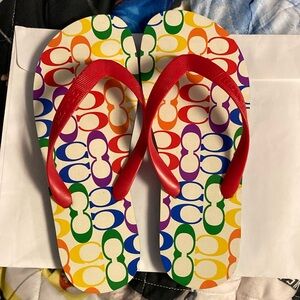 Never worn pair of women’s Coach flip flops.  No box.  Great condition
